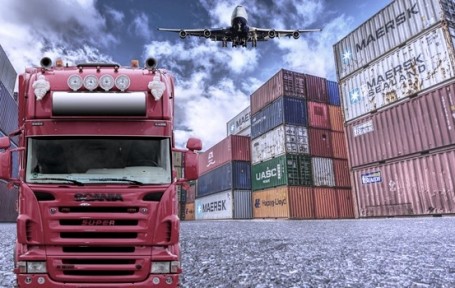Supply Chain Management: Image of a truck, a cargo plane, numerous cargo containers.
